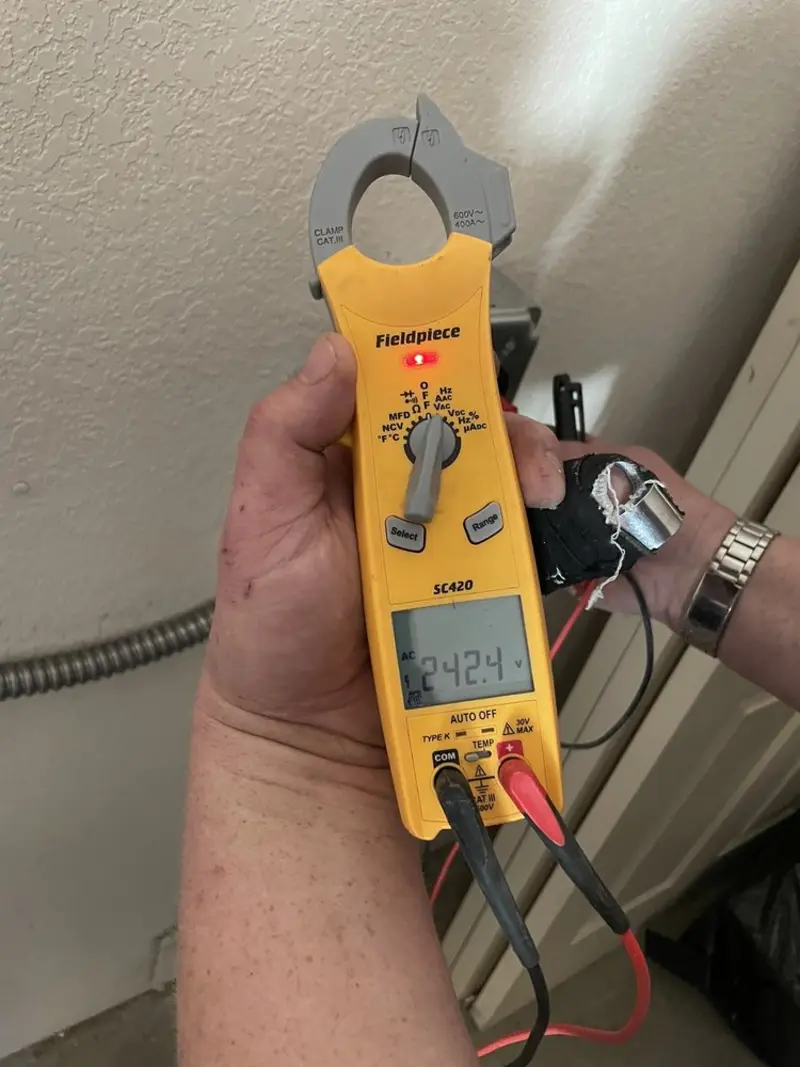Voltage testing with clamp meter during Ceiling Fan Installation in Westover